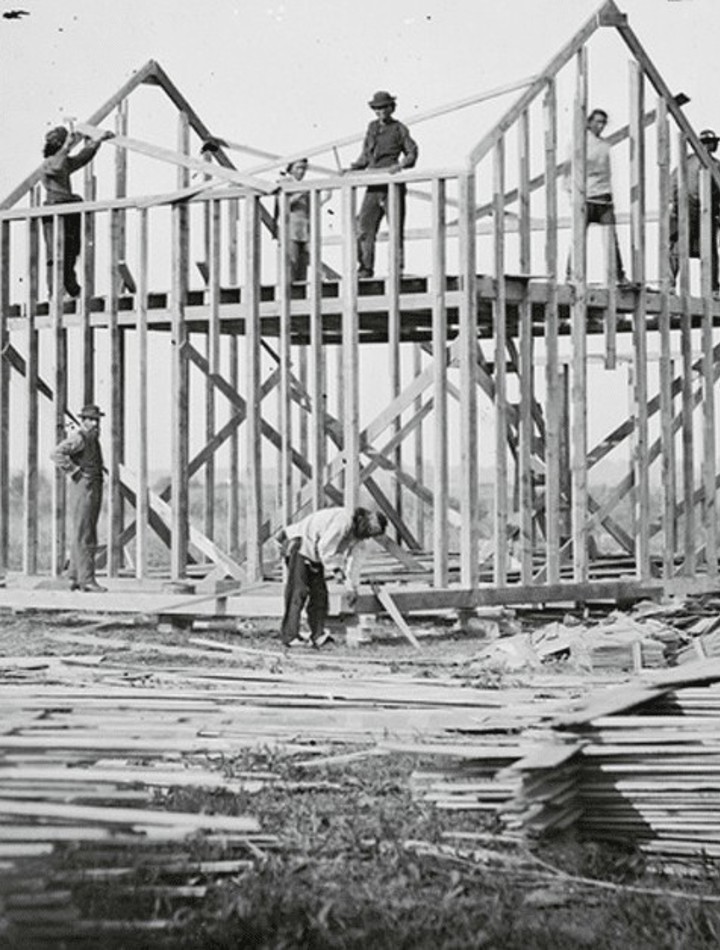Traditional framing crew prior to the widespread use of pneumatic nailers